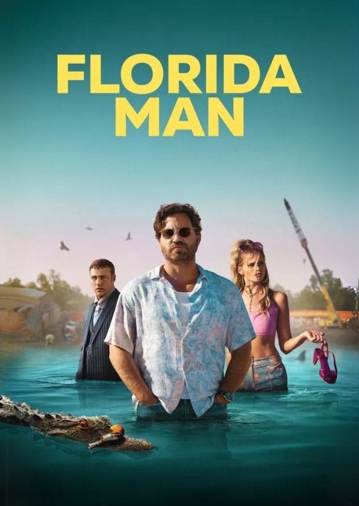 Florida Man (2023) แสดงภาพชายสามคนยืนอยู่ในน้ำที่ระดับเอว โดยมีชายคนกลางสวมแว่นกันแดดและเสื้อฮาวายสีฟ้าอ่อน ด้านหลังเป็นท้อง